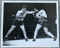 BRADDOCK, JAMES J.-TOMMY FARR TYPE 1 WIRE PHOTO (1938-BRADDOCK LANDING A LEFT)