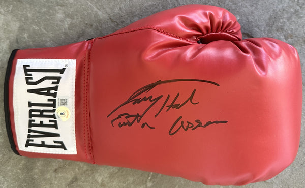 HOLMES, LARRY SIGNED BOXING GLOVE (BECKETT)