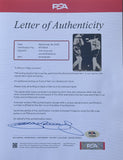 LOUIS, JOE & JIMMY BRADDOCK SIGNED ACTION PHOTOGRAPH (PSA/DNA)