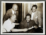 LOUIS, JOE ORIGINAL TYPE 1 PHOTO (1939-RECEIVING CHECK FOR GALENTO FIGHT)