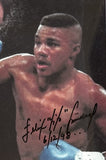 TRINIDAD, FELIX "TITO" SIGNED ACTION PHOTO (PSA/DNA)