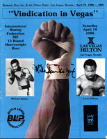 HOLMES, LARRY-MICHAEL SPINKS II SIGNED OFFICIAL PROGRAM (1986-SIGNED BY SPINKS)