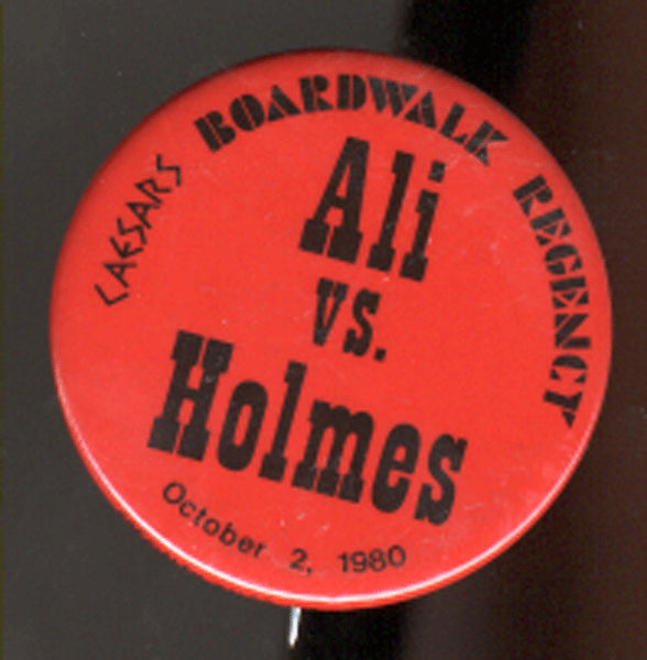 ALI, MUHAMMAD-LARRY HOLMES SOUVENIR PIN (1980)