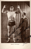 CARNERA, PRIMO SIGNED REAL PHOTO POSTCARD