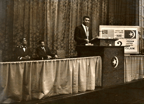 ALI, MUHAMMAD LARGE FORMAT PHOTO BY BINGHAM (1964-SPEAKING AT MUSLIM RALLY)