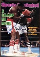 SPINKS, MICHAEL & LARRY HOLMES SIGNED SPORTS ILLUSTRATED COVER