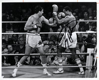 HOLMES, LARRY-GERRY COONEY SIGNED WIRE PHOTO (1981-SIGNED BY HOLMES)