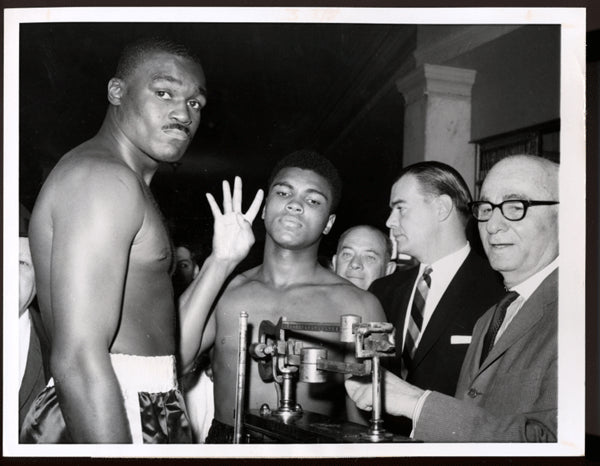 CLAY, CASSIUS-DOUG JONES WIRE PHOTO (1963)