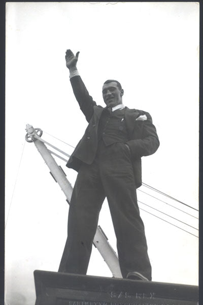 CARNERA, PRIMO REAL PHOTO POSTCARD (WAVING TO CROWD-1930'S)