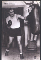 CARNERA, PRIMO REAL PHOTO POSTCARD (WORKING THE BAG-1930'S)