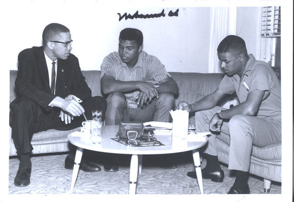 ALI, MUHAMMAD SIGNED PHOTOGRAPH (TALKING WITH MALCOLM X)