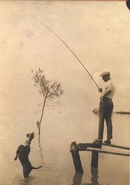 DEMPSEY, JACK TRAINING CAMP WIRE PHOTO (FISHING)