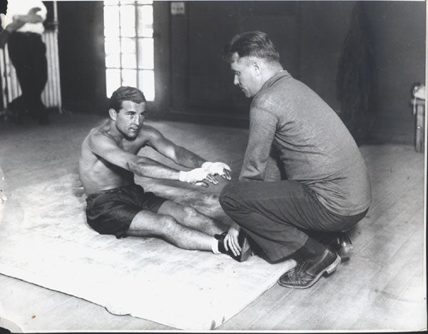 LABARBA, FIDEL ORIGINAL WIRE PHOTO (STRETCHING WITH TRAINER)