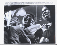 CLAY, CASSIUS-SONNY LISTON I ORIGINAL WIRE PHOTO (1964-CELEBRATING THE WIN)