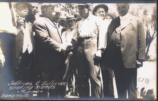 SULLIVAN, JOHN L. & JIM JEFFRIES REAL PHOTO POSTCARD (1910-SHAKING HANDS IN RENO)