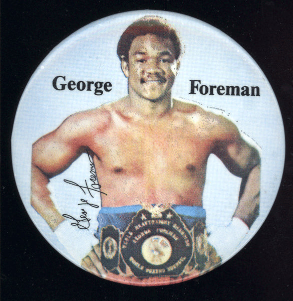 FOREMAN, GEORGE SOUVENIR PIN (EARLY 1970'S)