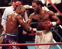 LEWIS, LENNOX SIGNED PHOTO (IN ACTION WITH HOLYFIELD)