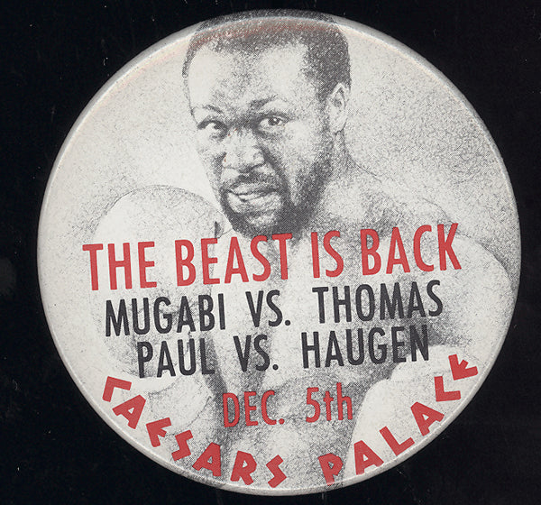 MUGABI, JOHN "THE BEAST"-DUANE THOMAS SOUVENIR PIN (1986)