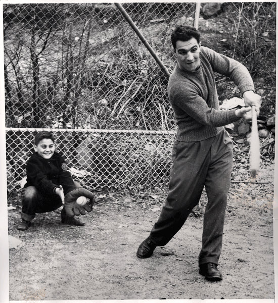MARCIANO, ROCKY WIRE PHOTO (1950-PLAYING BASEBALL WITH HIS BROTHER)