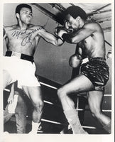 ALI, MUHAMMAD SIGNED WIRE PHOTO (1975-FIGHTING AL "BLUE" LEWIS-JSA)