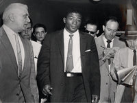 PATTERSON, FLOYD-TOMMY "HURRICANE" JACKSON LARGE FORMAT WIRE PHOTO (1957-POST FIGHT)