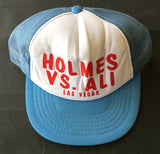 ALI, MUHAMMAD-LARRY HOLMES SOUVENIR CAP (1980)