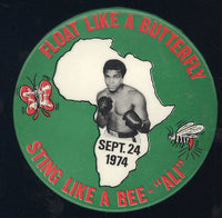 ALI, MUHAMMAD-GEORGE FOREMAN SOUVENIR PIN (1974)