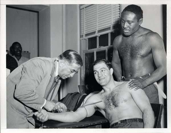 MARCIANO, ROCKY-EZZARD CHARLES I WIRE PHOTO (1954-PRE FIGHT MEDICAL)
