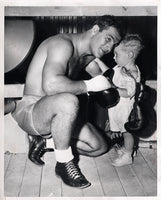 MARCIANO, ROCKY-EZZARD CHARLES II WIRE PHOTO (TRAINING CAMP)