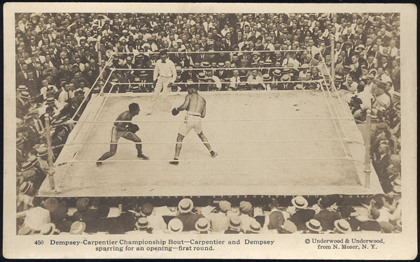 DEMPSEY, JACK-GEORGES CARPENTIER REAL PHOTO POSTCARD (1921-IN ACTION FIRST ROUND)