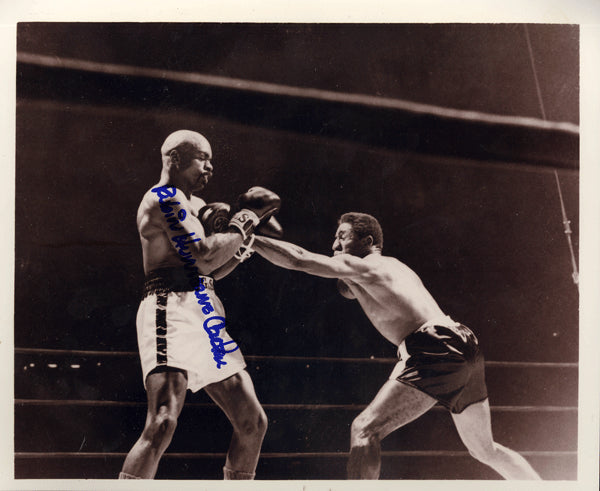 CARTER, RUBIN "HURRICANE" SIGNED PHOTO (FIGHTING LUIS RODRIGUEZ)