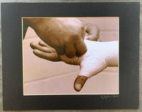 CINTRON, KERMIT HAND WRAPPING ORIGINAL PHOTOGRAPH BY JEFF JULIAN (2003)