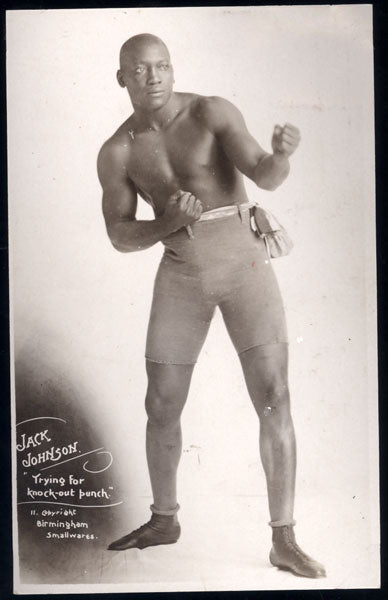 JOHNSON, JACK "TRYING FOR KNOCK-OUT PUNCH REAL PHOTO POSTCARD