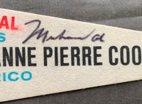 ALI, MUHAMMAD-JEANNE PIERRE COOPMAN SIGNED SOUVENIR PENNANT (1976)