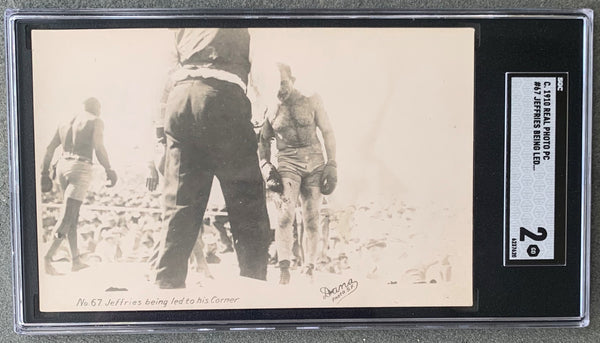 JOHNSON, JACK-JAMES JEFFRIES REAL PHOTO POSTCARD (1910-JEFFRIES LED TO HIS CORNER-SGC)