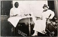 JOHNSON, JACK & WIFE REAL PHOTO POSTCARD (1912-FLYNN FIGHT)