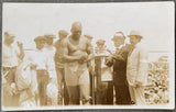 JOHNSON, JACK-JESS WILLARD REAL PHOTO POSTCARD (1915-JOHNSON WEIGHING IN)