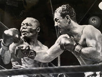 MARCIANO, ROCKY-JERSEY JOE WALCOTT I ORIGINAL WIRE PHOTO (1952-FAMOUS PUNCH)